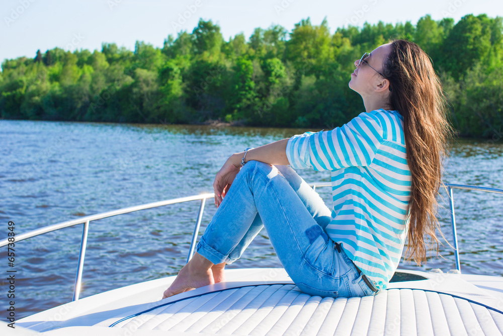 Young woman relaxing on yacht in summer day Young woman relaxing on yacht in summer day