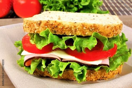 Sandwich with meat  tomato  lettuce and cheese