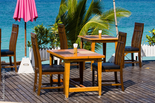 Table and chairs with a beautiful sea view, Thailand © OlegD