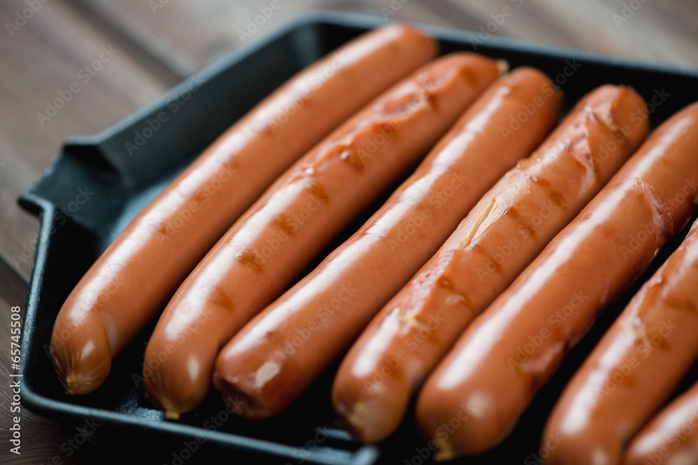Close-up of roasted sausages on a grill, horizontal shot Close-up of roasted sausages on a grill, horizontal shot
