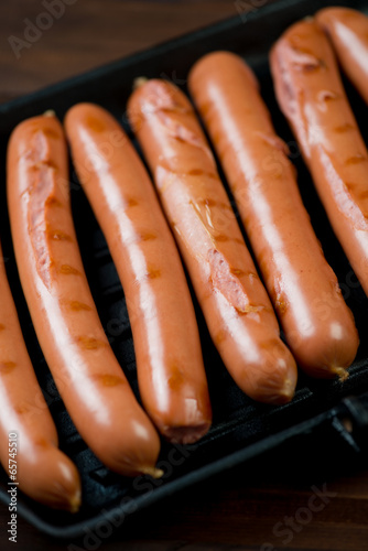 Close-up of grilled sausages, vertical shot, high angle view