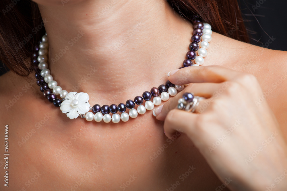 Woman with pearl necklace on her neck