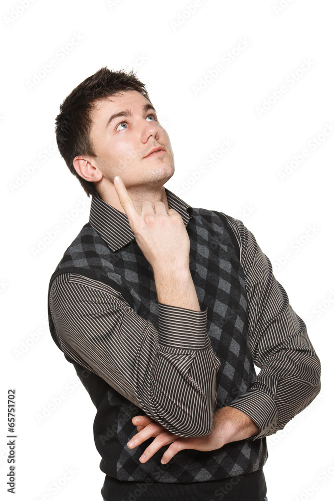 Surprised young man looking and pointing up Surprised young man looking and pointing up
