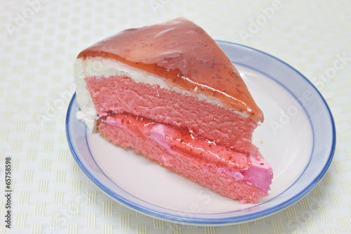 Strawberry cheesecake in plate on background