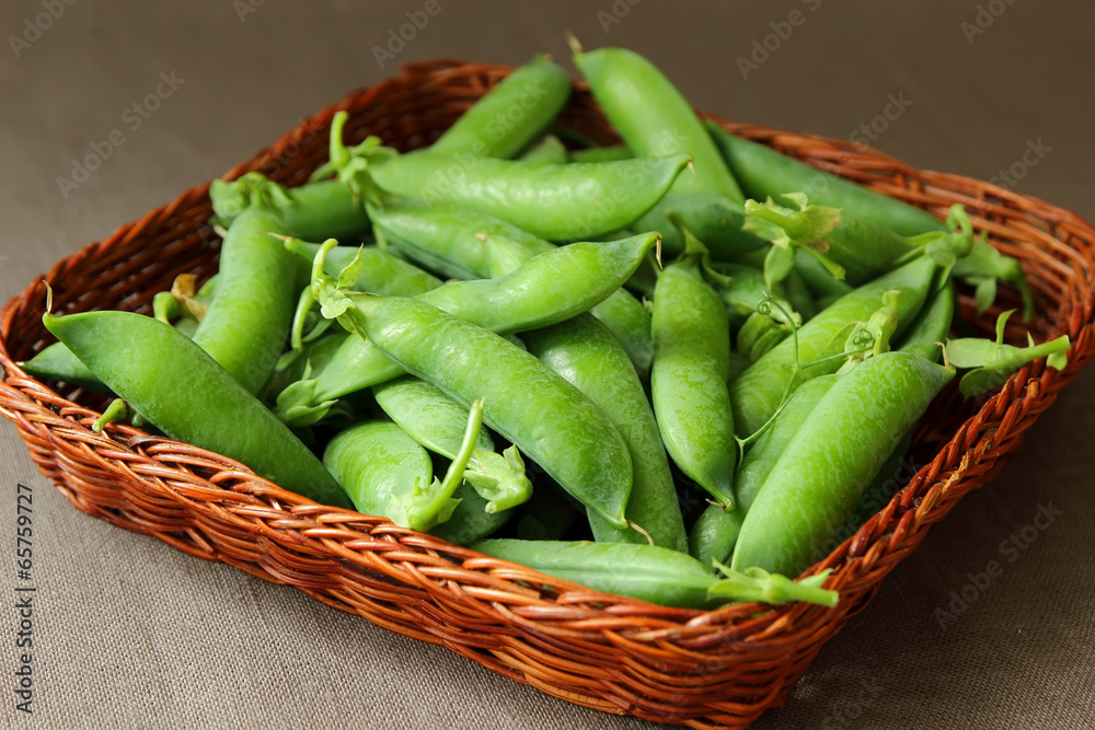 Peas in pods, reclining with a basket. Peas in pods, reclining with a basket.