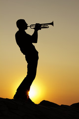 Silhouette of trumpet player