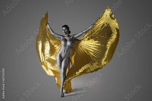 Half Naked Woman Spreading Her Golden Wings photo