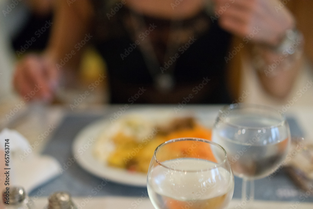 Glass of white wine on a dinner table