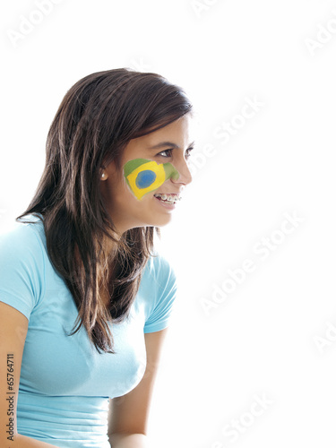 girl with brazilian flag face paint photo