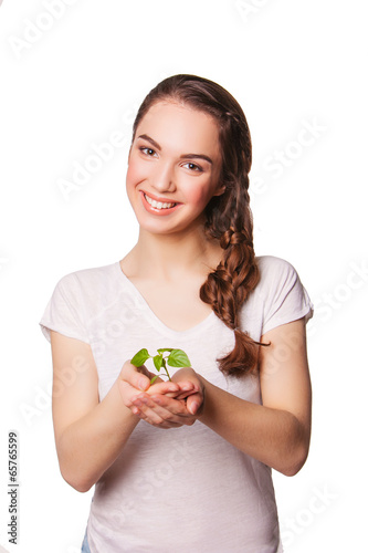 smiling beautiful woman holding plant. eco concept