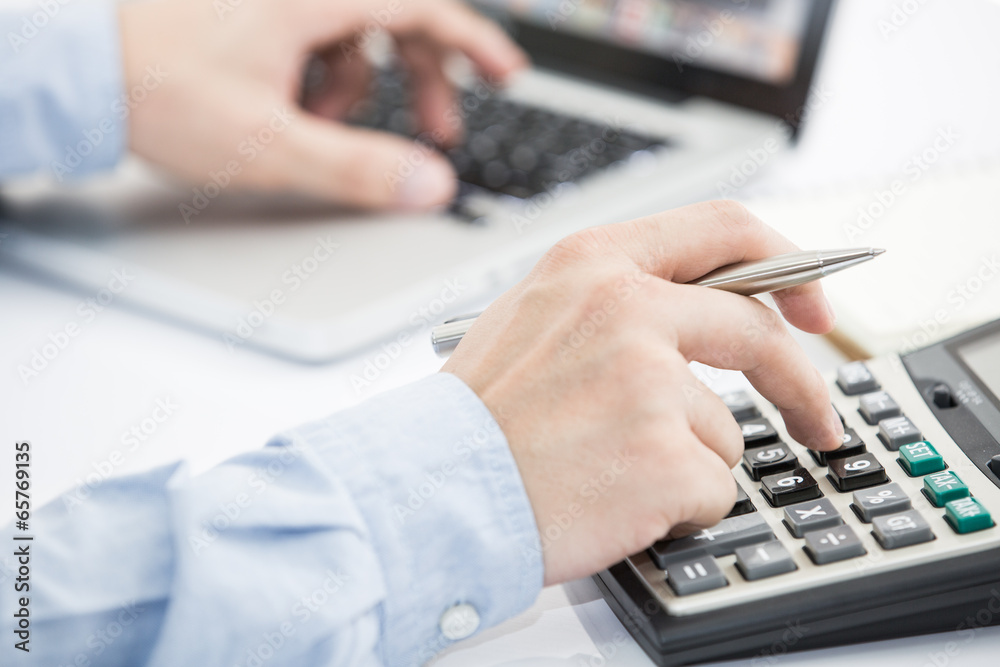 Businessman analyzing investment charts with laptop Businessman analyzing investment charts with laptop