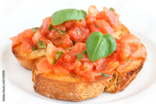 Classic italian bruschetta with tomato and basil on bread