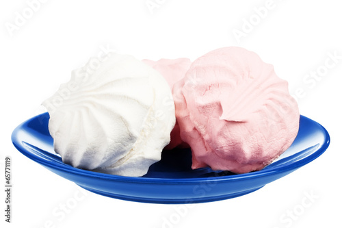 Marshmallows on blue plate photo