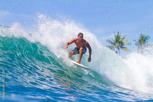 Surfing a Wave. Bali Island. Indonesia. © trubavink