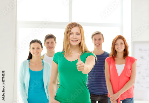smiling students with teenage girl in front