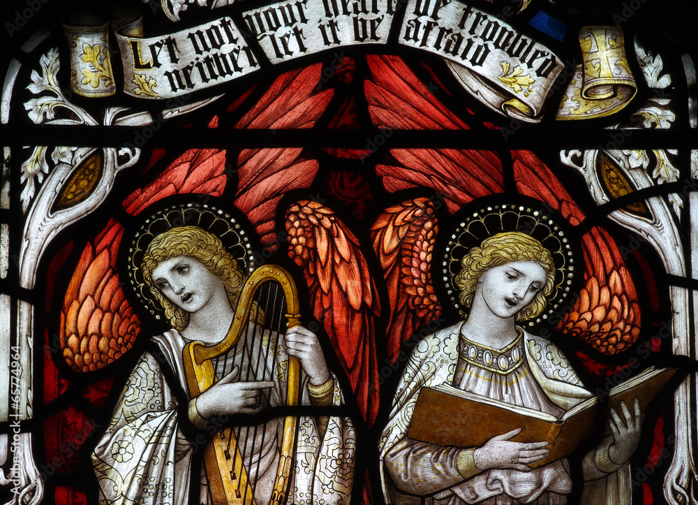 Two angels making music and singing in stained glass