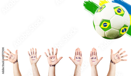 Cheering hands, soccer ball and the Brazil flag