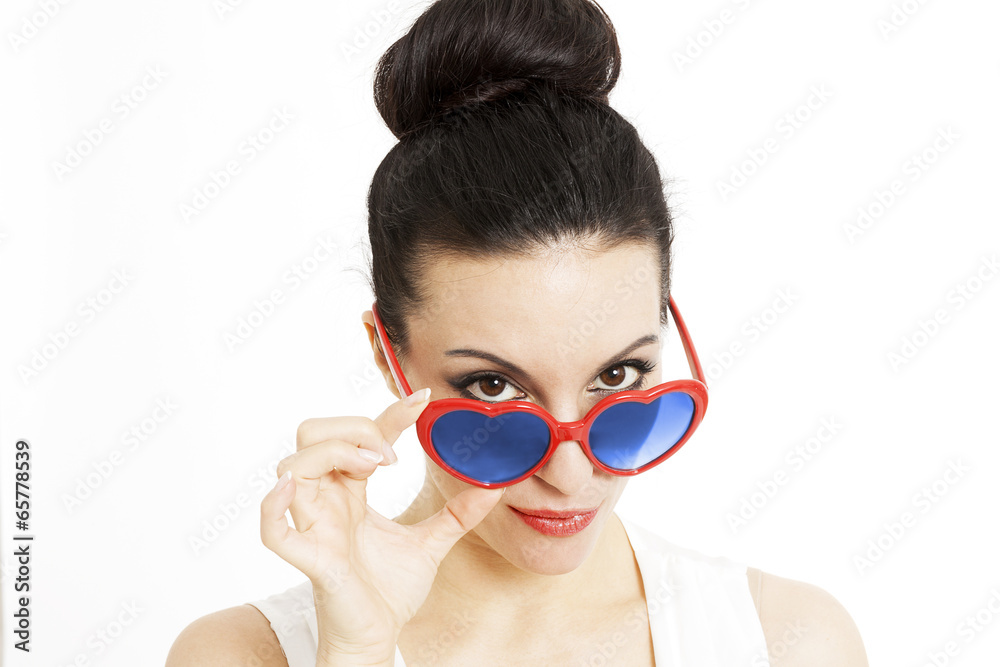 Portrait of a beautiful woman in blue with heart shaped glasses Portrait of a beautiful woman in blue with heart shaped glasses