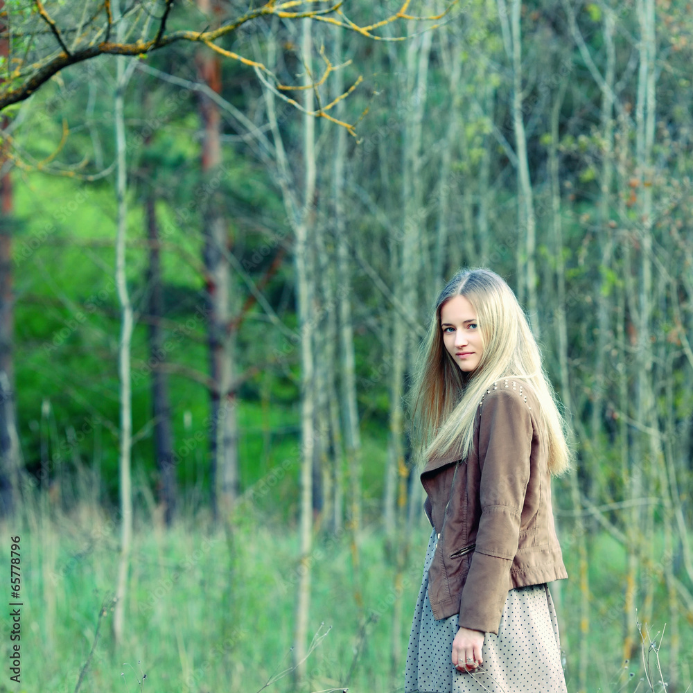 Portrait of romantic fashion young woman smile in the woods. Portrait of romantic fashion young woman smile in the woods.