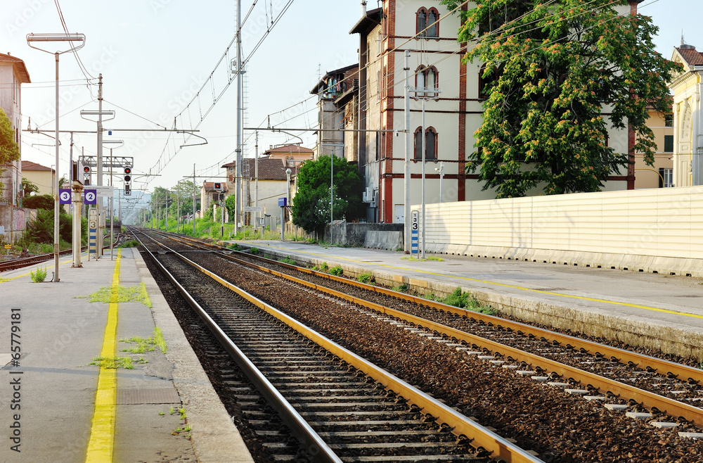 Train station and steel railway tracks, Italy
