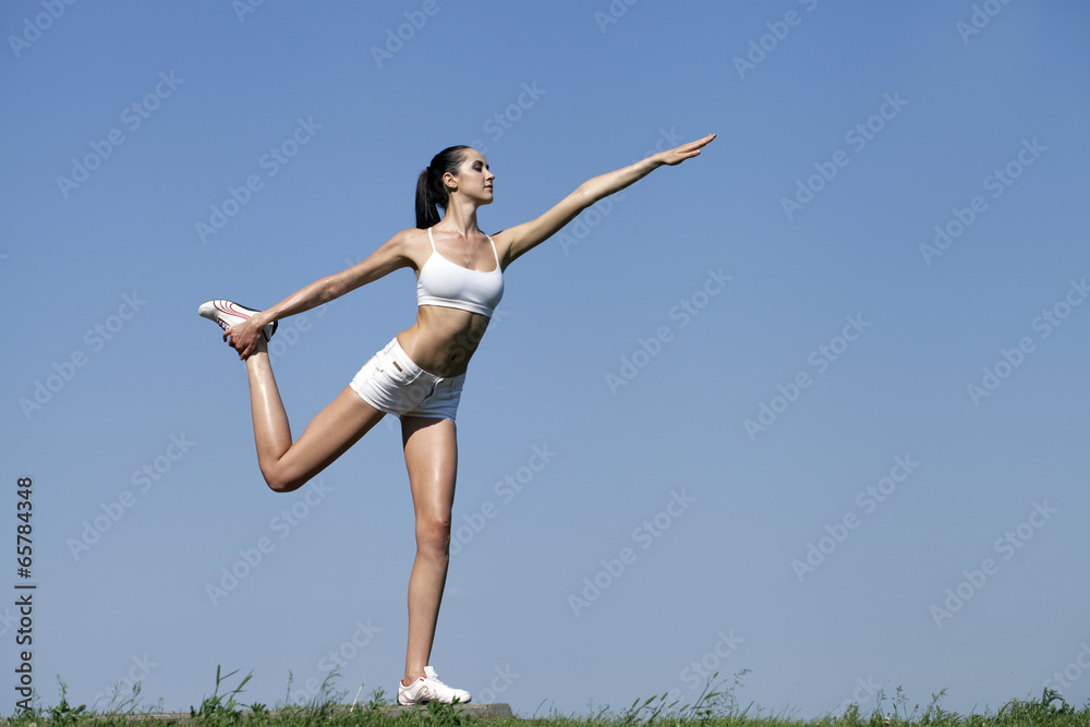 Fitness woman exercising in summer park Fitness woman exercising in summer park