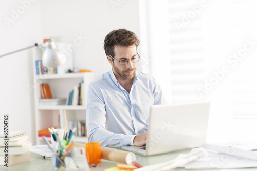 modern businnessman working on his laptop at office