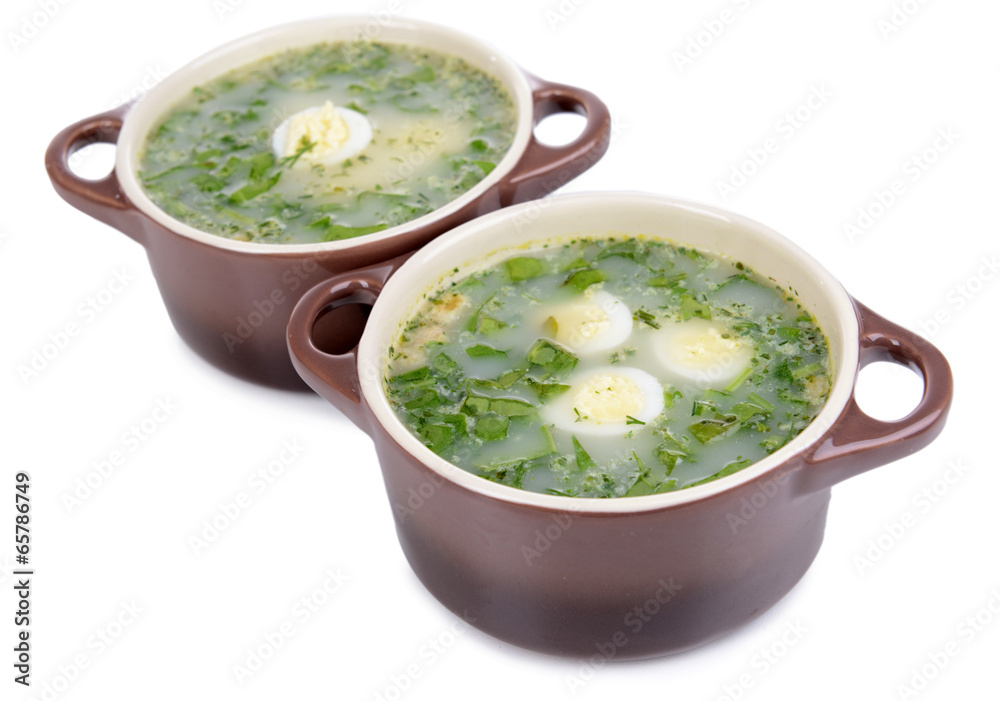 Delicious green soup with sorrel isolated on white Delicious green soup with sorrel isolated on white