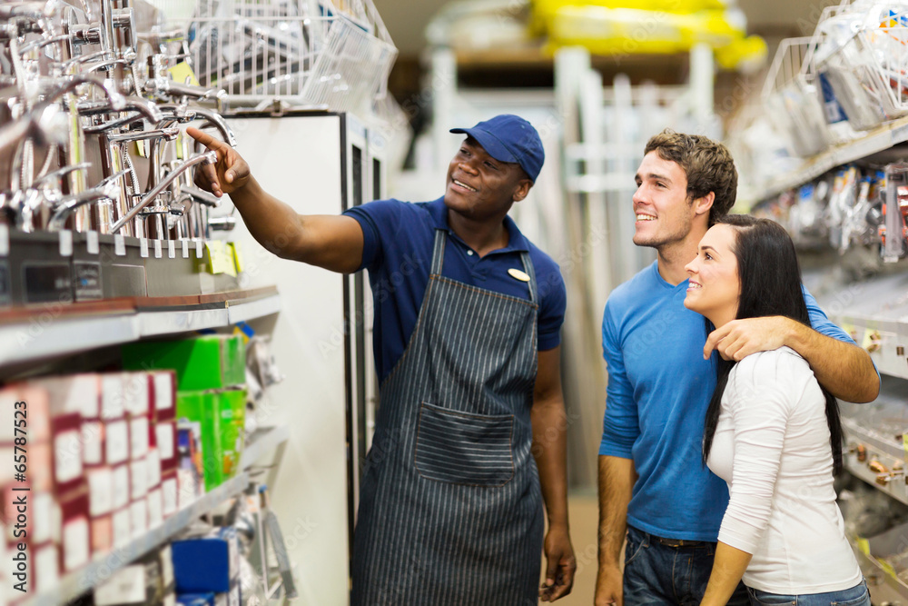 african hardware store assistant helping customers Stock Photo Adobe