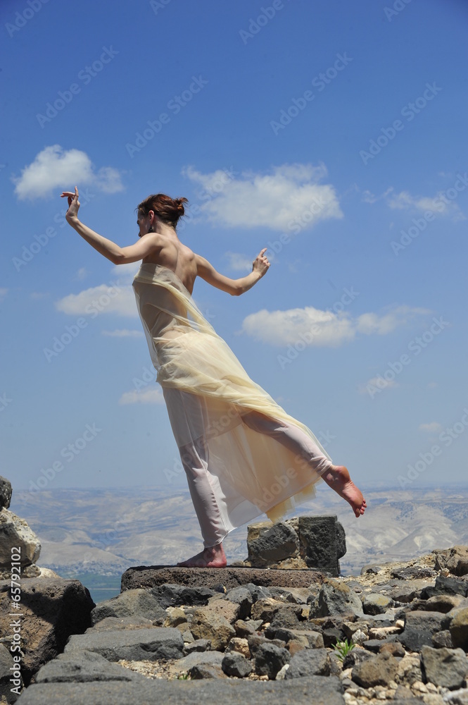 Young woman on a sky background