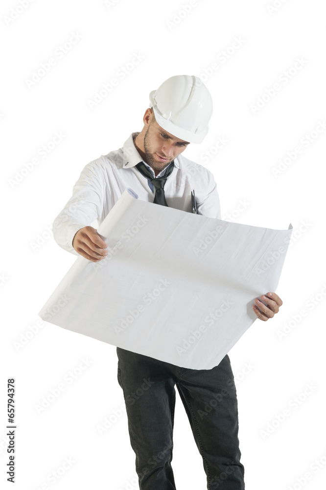 Young handsome engineer reading technical drawing plans Young handsome engineer reading technical drawing plans