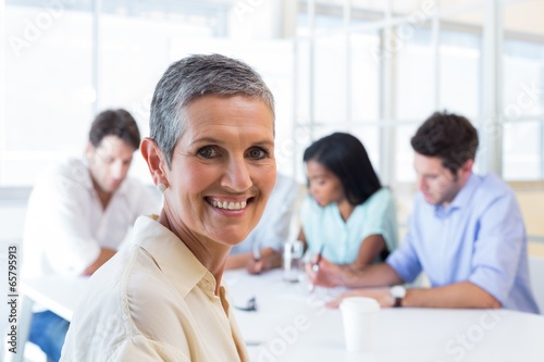 Attractive businesswoman smiling in the workplace © WavebreakMediaMicro