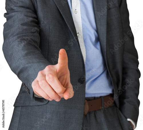 Businessman in grey suit pointing