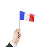hand holding flag of France