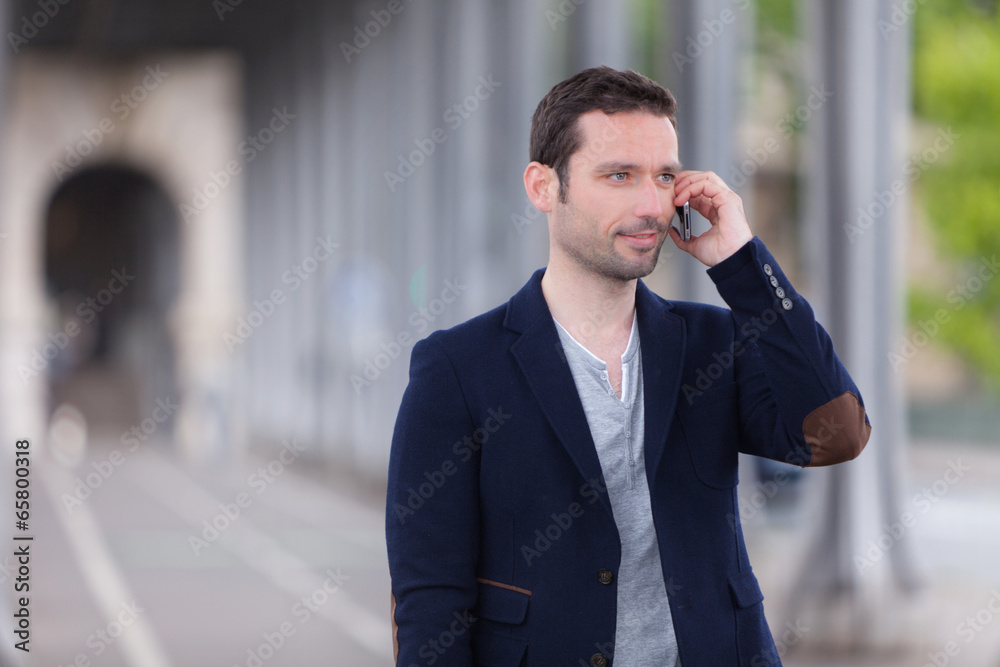 Young attractive man using smartphone in Paris Young attractive man using smartphone in Paris