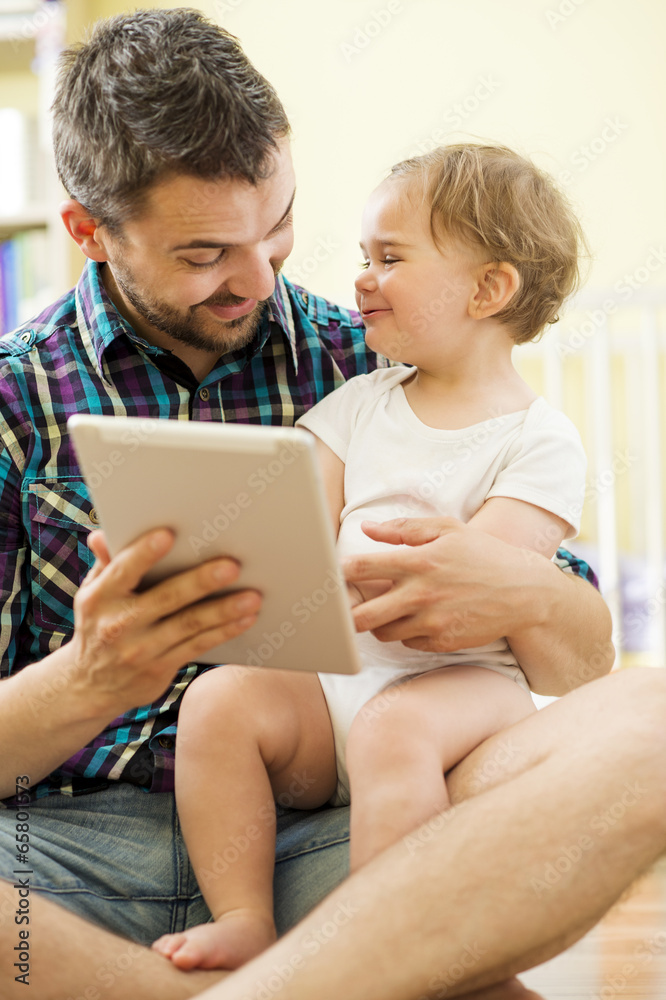 Father and daughter with tablet