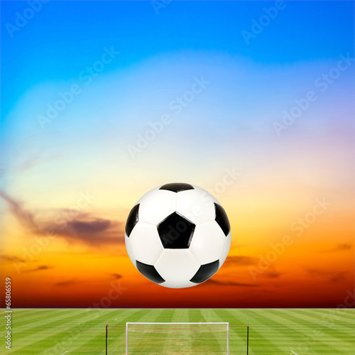 soccer ball with soccer field against beautiful sunset © Satit _Srihin