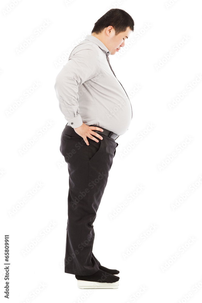 fat business man standing on weight scale fat business man standing on weight scale
