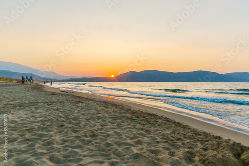 Fototapeta Naklejka Na Ścianę i Meble -  Beach on sunset in village Kavros in Crete  island, Greece.