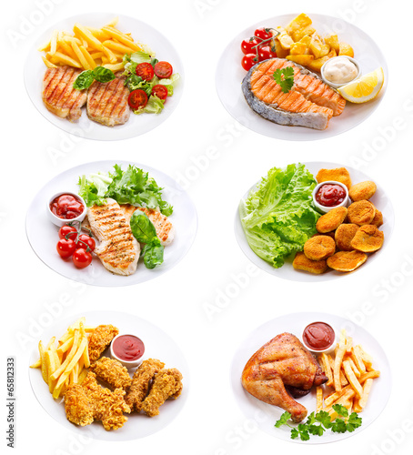 plates of various meat, fish and chicken