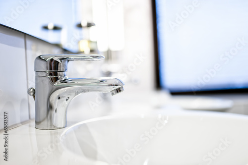 Contemporary bathroom sink taps and mirrors in luxury home