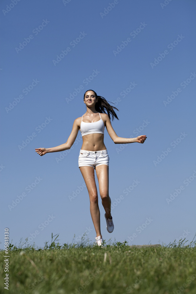 Fitness woman exercising in summer park Fitness woman exercising in summer park