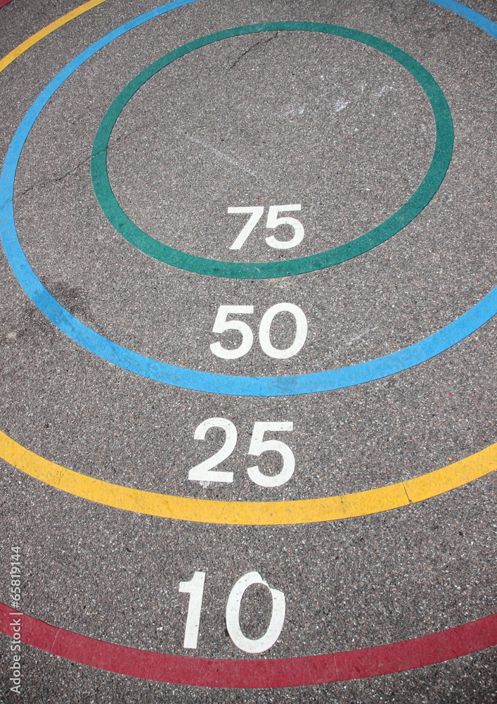 Fototapeta premium Quoits game with winning circles on asphalt