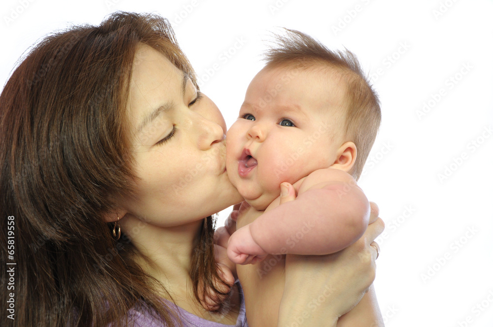 Mother kissing newborn baby Mother kissing newborn baby
