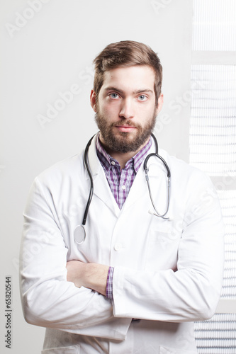 Portrait of a happy young male doctor
