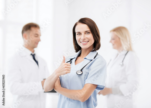 team of doctors showing thumbs up