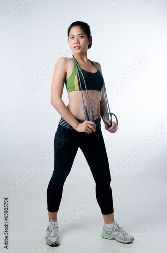 Sporty beautiful woman with skip rope © lalilele13