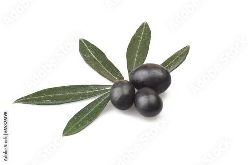 Black olive and leaves on the  white