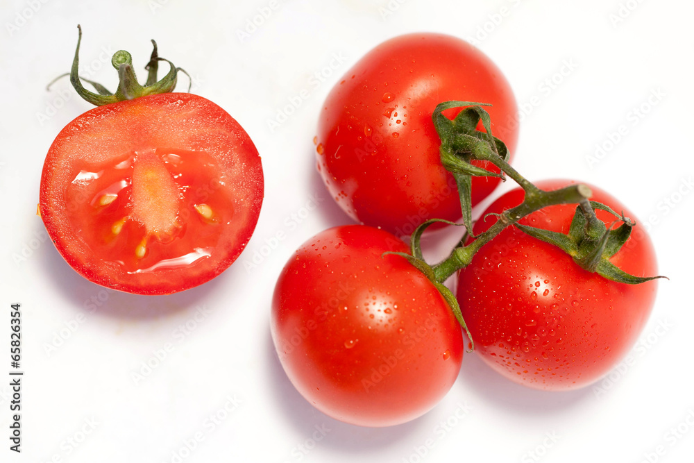 Bunch of fresh tomatoes with water drops