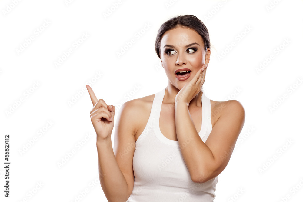happy young woman showing with her finger up happy young woman showing with her finger up