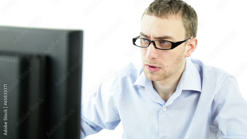 Angry frustrated business man working computer isolated white
